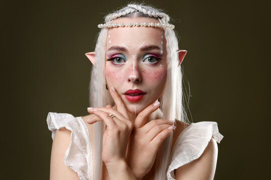 Beautiful elf girl on dark olive background