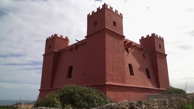 Architectural detail of Saint Agatha's Tower with iconic red stone, Malta