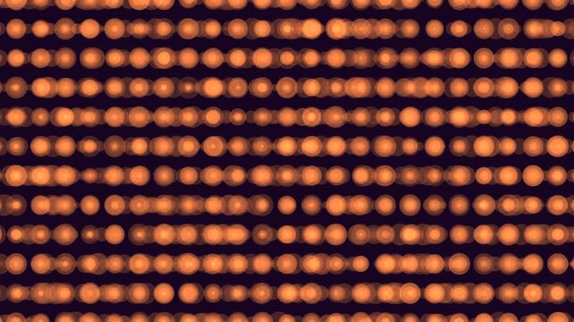 Defocused warm orange bokeh lights arranged in horizontal rows on a dark background, creating an abstract festive pattern for overlays, intros, and motion design