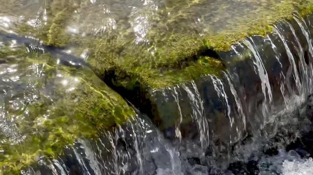 Crystal Clear Water Flowing Over Stone Steps in Wadi Hanifa