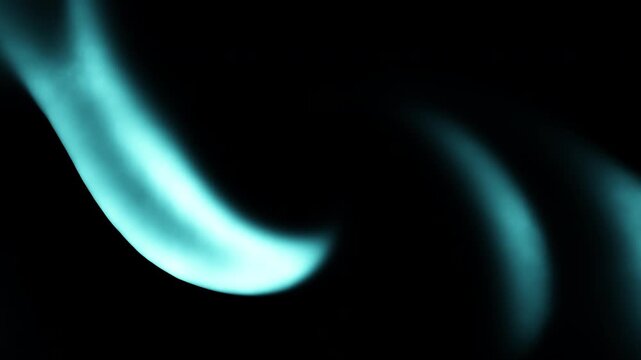 Abstract turquoise light trails swirl in a circular pattern on a black background, creating a glowing vortex effect for technology, energy, and modern design themes