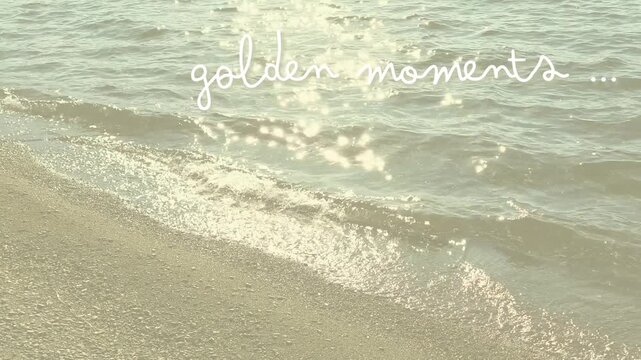 Animated "Golden Moments" Text on muted faded golden waters at the sandy shoreline w/twinkles & sparkles for backdrop, background, border, wallpaper - fades in & out softly, beach, sand, seaside, sun