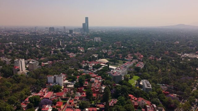 Aerial shot of south Mexico City skyline with smog and traffic