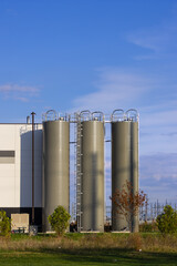 Fototapeta premium Industrial storage silos for production plant facility