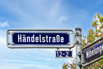 Fototapeta premium Street name Händelstrase - engl alley of Händel - in Frankfurt on a blue enamel sign