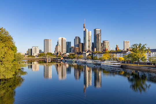 view to Frankfurt skyline with reflection of skyscraper in River Main
