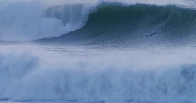 Extreme wave action turbulent sea powerful crash slow motion
