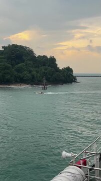 DEPARTING BY FERRY ON THE SUNDA STRAIT TO SUMATRA