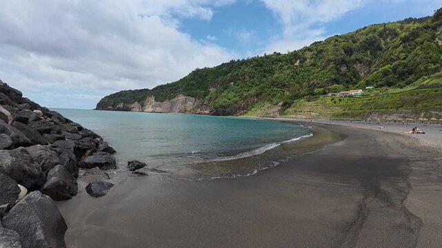 Seascape with rugged basalt coastline and a quiet bay