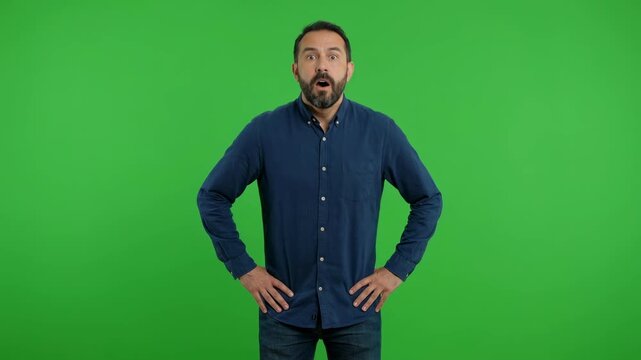 Surprised and shocked middle aged man gasping with mouth open on green screen background for reaction and advertising concepts