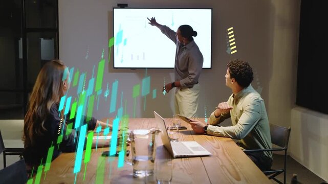 Presenter pointing at slide, team debating finance as candles and down arrows overlaying table
