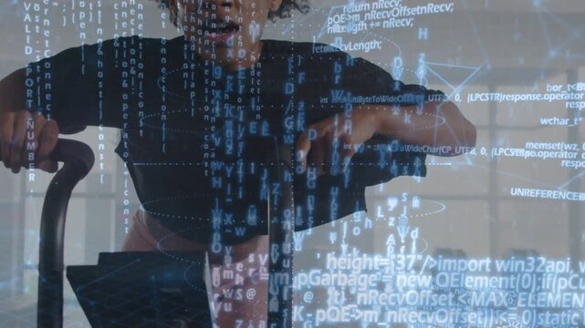 Woman pedaling air bike, upping cadence for fitness sprint, code overlay partly obscuring face