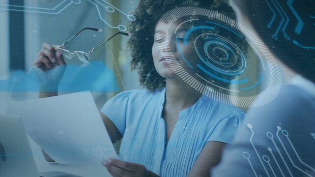 Business analyst reading report, spotting data removing specs while HUD marking KPIs for colleague