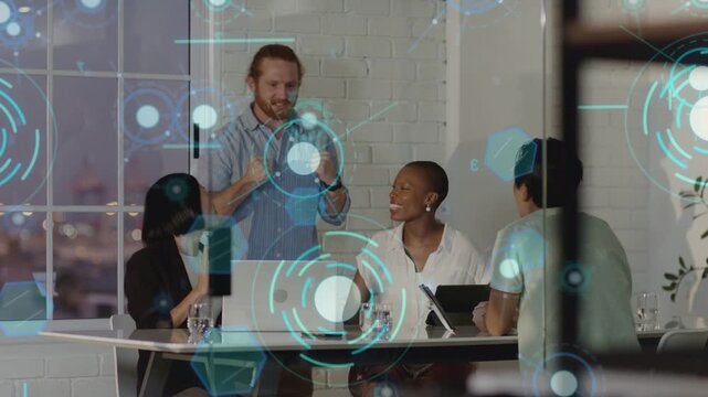 Business team reacting to tablet update, celebrating win while HUD graphics overlaying screens