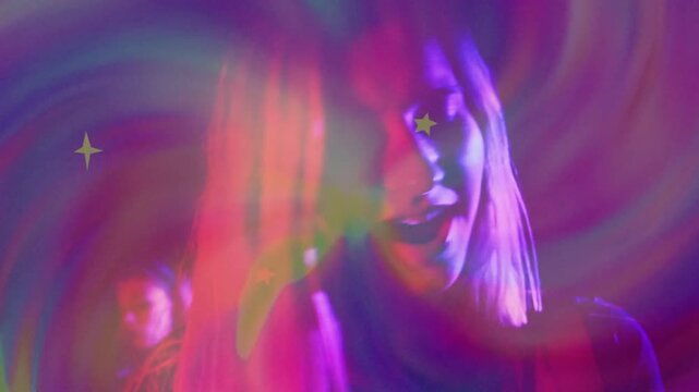 Female singer leaning smiling singing, causing pulsing stars, swirling lights across face for music