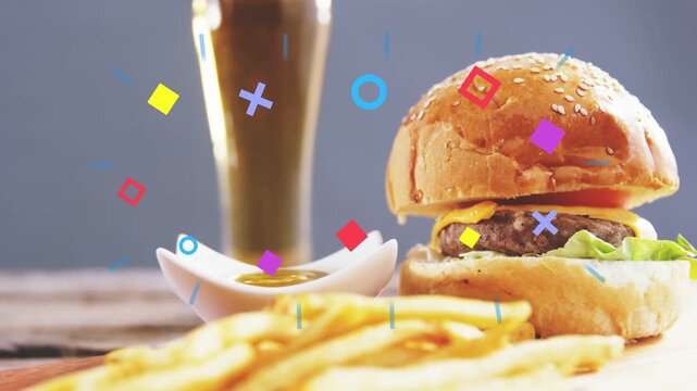 On cue shapes popping, sweeping over beer, burger, focus blurring fries, fading, revealing food