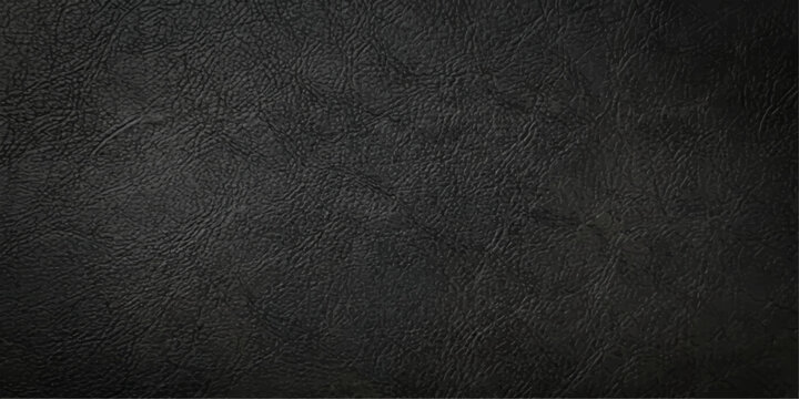 A dark textured black leather surface with a macro closeup pattern of old rough material creates a grunge textile background for a design wallpaper or backdrop