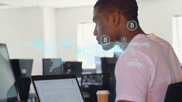 Dev typing at laptop in office, overlay sparking Bitcoin map analysis icons floating before him
