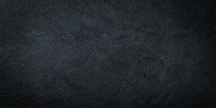 Dark textured black leather surface with a rough grain pattern for a grunge fashion material backdrop or wallpaper