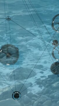Vertical video: Water ripple starting motion glass orbs bobbing and rotating rings revealing glints
