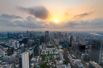 Obraz premium Cityscape Bangkok from a height aerial view sunrise, many high skyscrapers, panorama view into the distance central district