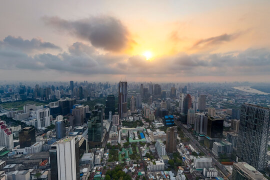 Cityscape Bangkok from a height aerial view sunrise, many high skyscrapers, panorama view into the distance central district