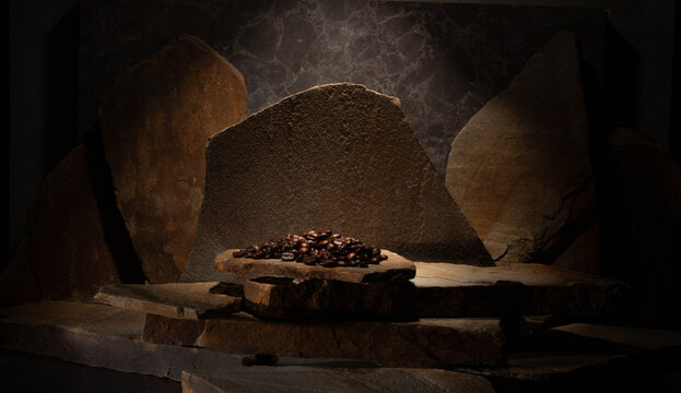 Cosmetic dark background podium with natural stones for presentation of makeup products, cosmetics, fragrances, jewelry