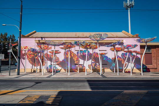 Elysian Fields public art installation featuring stained glass flowers on Jetty Road, Glenelg, South Australia, Australia