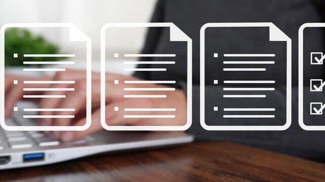 Close-up of a woman's hand working on a computer as she points to an animation of several documents scrolling by.