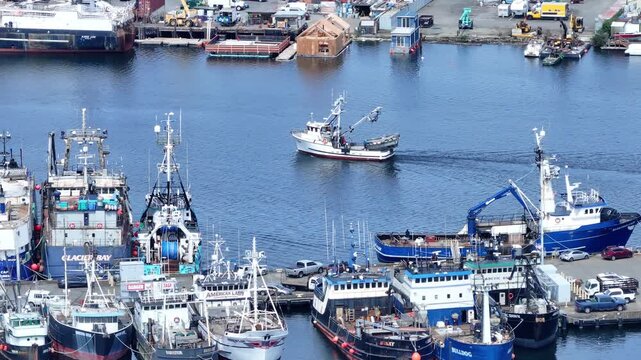 Aerial of Fishing vessel leaving Fishermans Terminal with Ballard #010