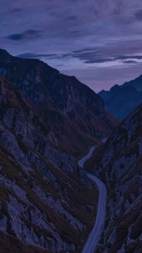 Twilight Valley With Winding Path. Winding Mountain Trail Cutting Through Rocky Valley During Sunset