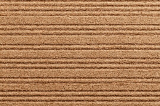 Close-up textured brown surface with parallel horizontal ridges