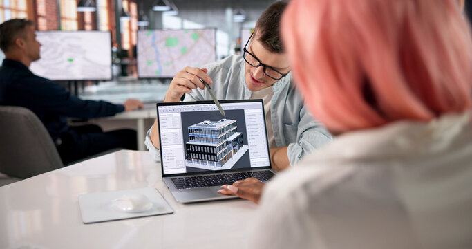 Architect Leads Diverse Team Reviewing 3D BIM Model During Project