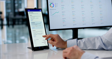 Obraz premium Experienced Sales Manager Uses Smart Touchscreen Panel