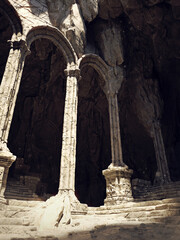 Fototapeta premium Fantasy scene with stone arches in a ruined ancient temple, with stairs and columns. Made from 3d resources and painted elements. No AI used. 