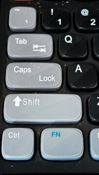 Keyboard Keys: Close-up of a modern keyboard layout. The keys are a mix of light and dark colors. Focus on the alphabet and function keys.
