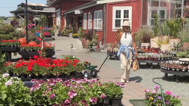 woman at garden center buying flowers for her garden