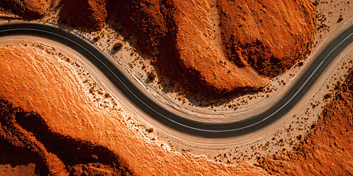 Cinematic Winding Paved Road in Arid Red Desert