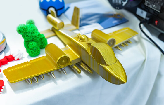 Model yellow miniature fighter jet created on a 3d printer
