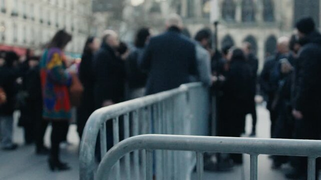 Photographers and journalists waiting for celebrities behind barriers