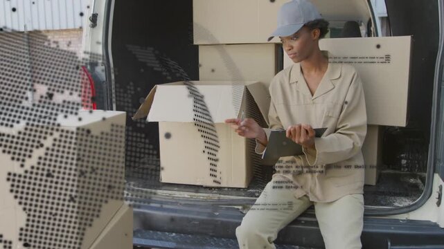 Vertical video: Woman sitting on van tapping pad checking logistics, dotted overlay tracking boxes