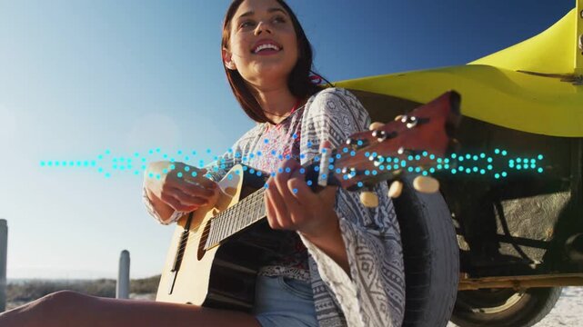 Cam starting low rising woman playing guitar singing blue wave moving near yellow car sharing song