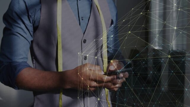Male tailor tapping and scrolling phone, checking tape, network overlay shifting right around torso