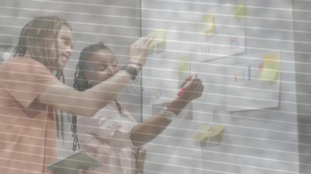 Woman raising red marker, man holding tablet pointing, writing and moving sticky notes for business