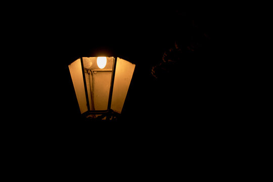 Lantern in the Darkness presented in a natural scene in an outdoor setting, in a clean visual environment, under night light, with a warm mood, suitable for travel, outdoor, and lifestyle campaigns.