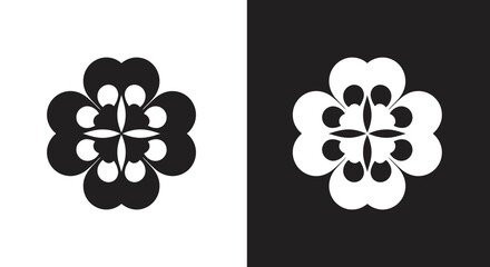 A striking black and white symmetrical floral design featuring four petals with rounded lobes © grvect02