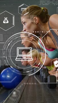 Vertical video: Fitness class pressing weights, camera rising, HUD scaling over row, tracking sales