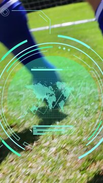 Vertical video: Soccer player nudging ball on pitch, HUD graphs overlaying, showing shot toward net