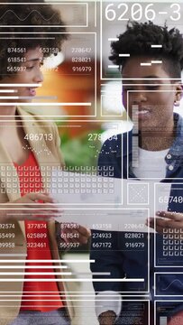 Vertical video: Two women reviewing printout, handoff starting HUD data and guiding business edits