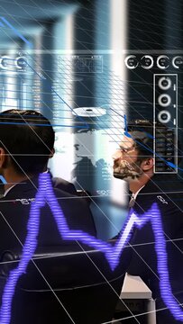Vertical video: Two traders tracking AR appearing for markets, pulsing waveform rotating gauges